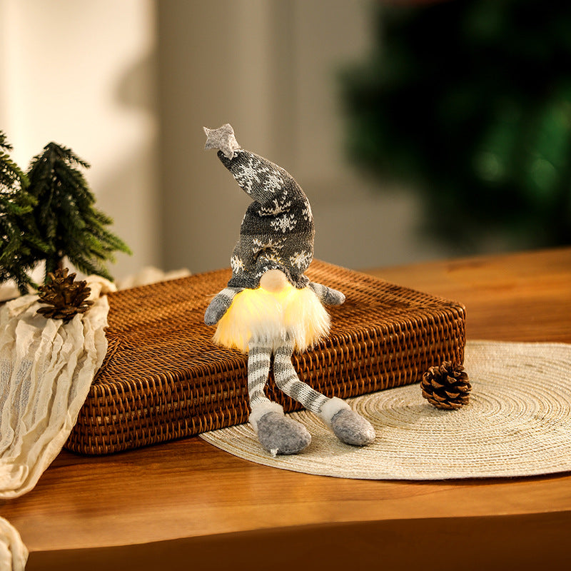 Illuminated gnome figure, sitting, with knit hat