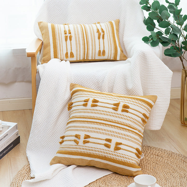 Woven decorative cushion cover with ordered tassel application and structured jacquard weaving Kalsten