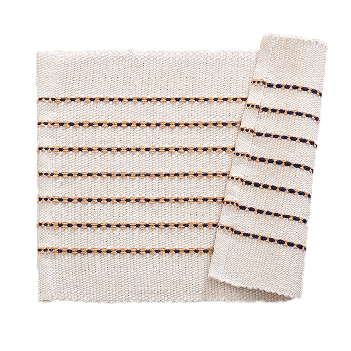 Woven placemats and table runners made of cotton blend with fine dot stripes and knot applications Kalsten