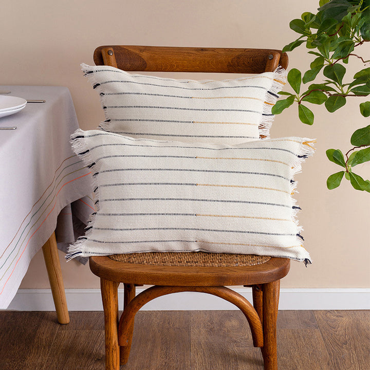 Decorative cotton cushion cover with striped tufted appearance and fringes