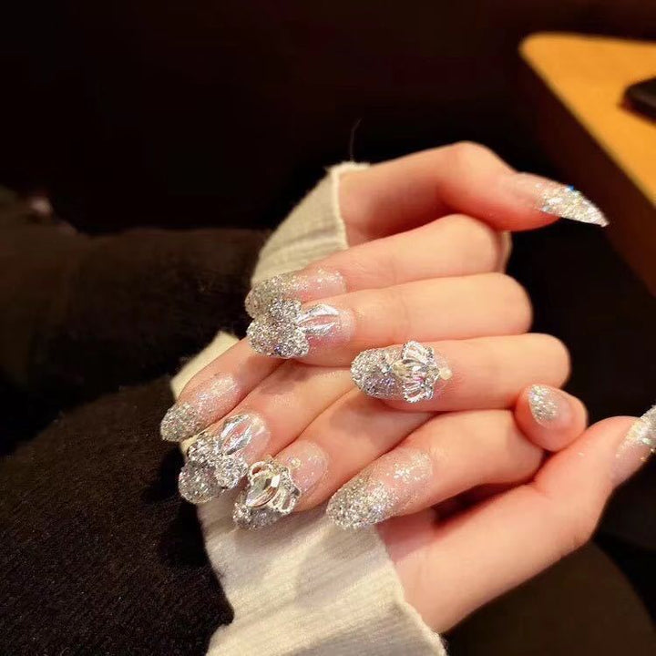 Nail art with sparkling rhinestone and glitter accents Kalsten