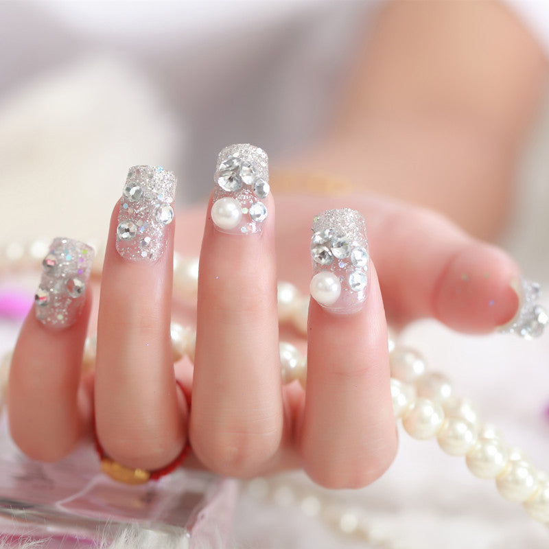 Art nails with glitter and pearl accents Kalsten