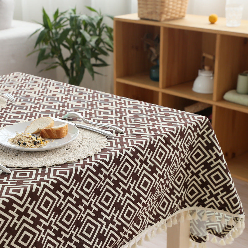Woven cotton tablecloth with ethnic jacquard pattern and tassel trim