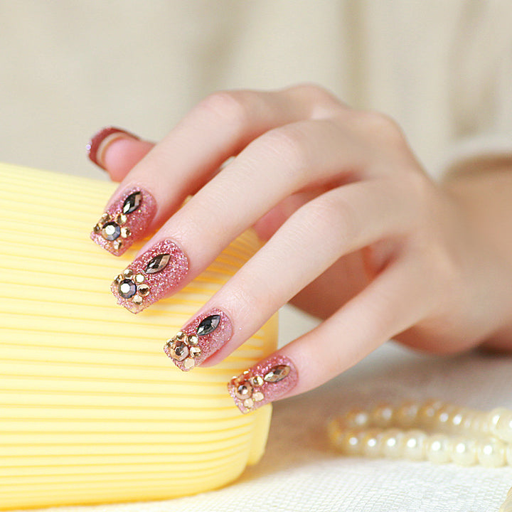 Glamorous artificial nails with glitter and jewelry decoration Kalsten