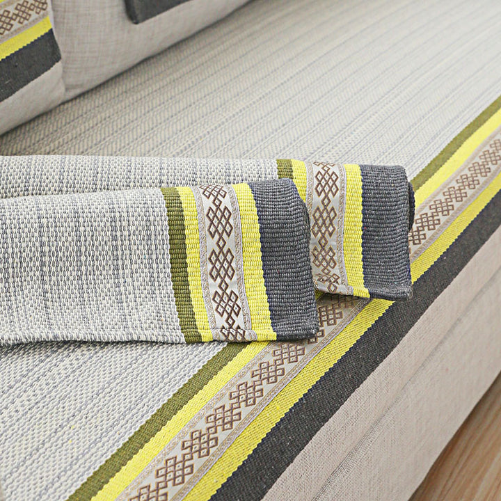 Handwoven table runner made of cotton blend with woven decorative border and striped texture