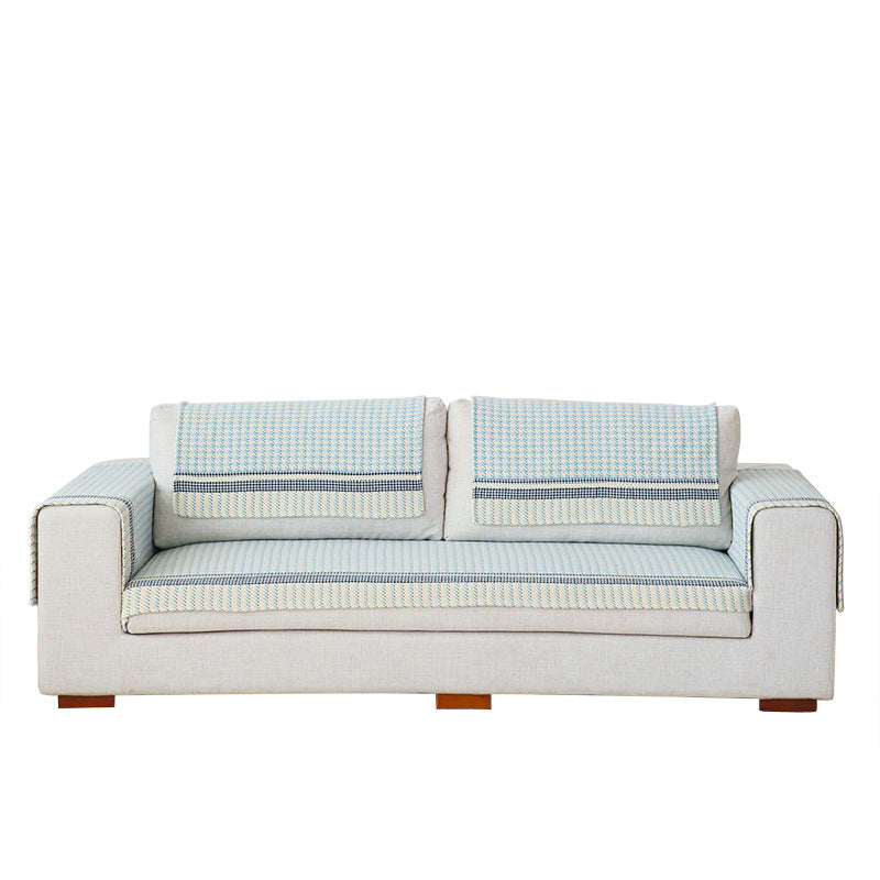 Handwoven breathable mattress topper with checkered decorative ribbon
