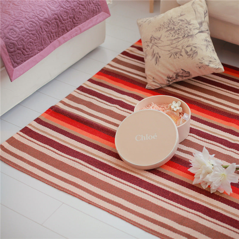 Flat-woven living and bedroom carpet with striped structure and anti-slip backing