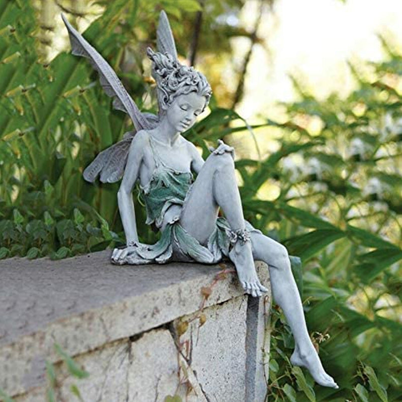 Kalsten | Statue of sitting fairy in the garden