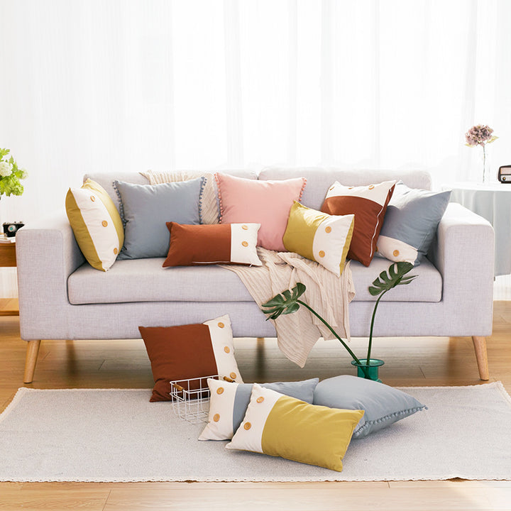 Decorative cushion cover with pompom border made of cotton-linen blend