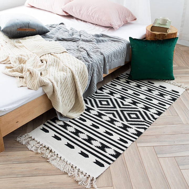 Woven decorative runner made of cotton blend with ethnic diamond pattern and fringes