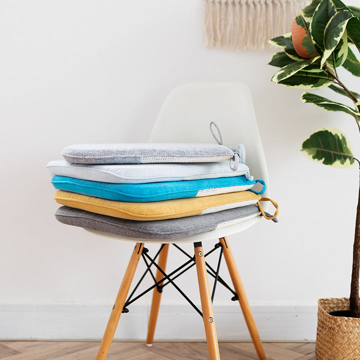 Padded chair cushion with ties in linen look