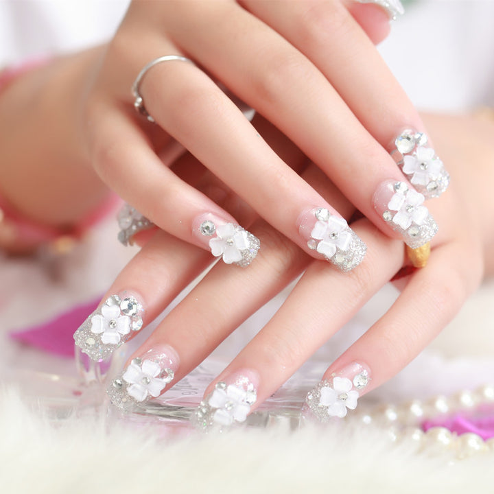 Artificial nails with glitter and floral 3D accents Kalsten