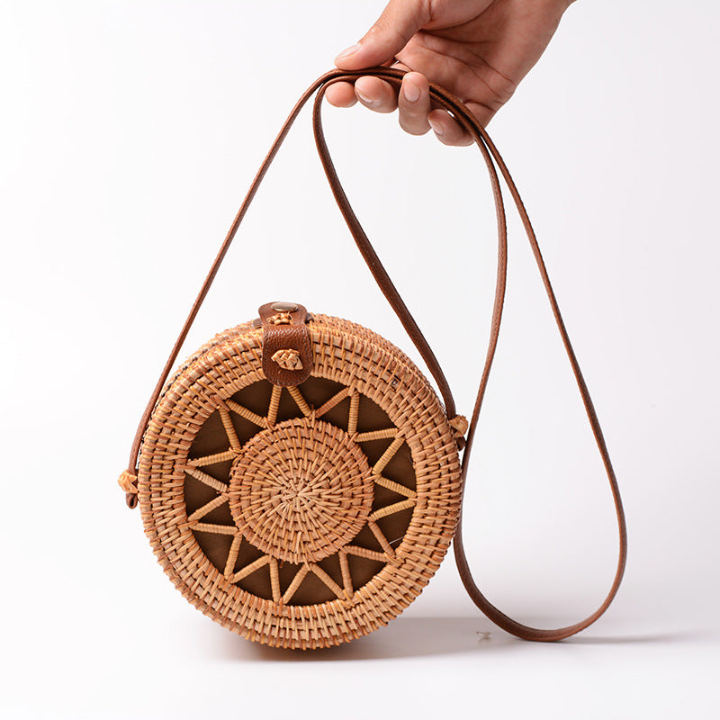 Elegant round handbag made of woven rattan Kalsten