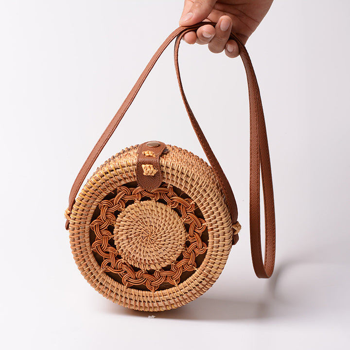 Elegant round handbag made of woven rattan Kalsten