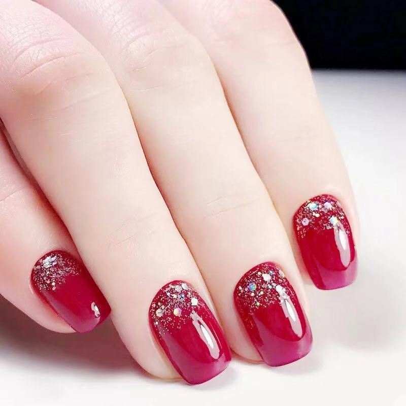 Glamorous artificial nails with glitter accents Kalsten