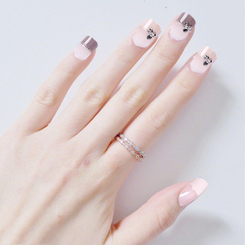 Elegant Nail Art Tips with Decorative Accents