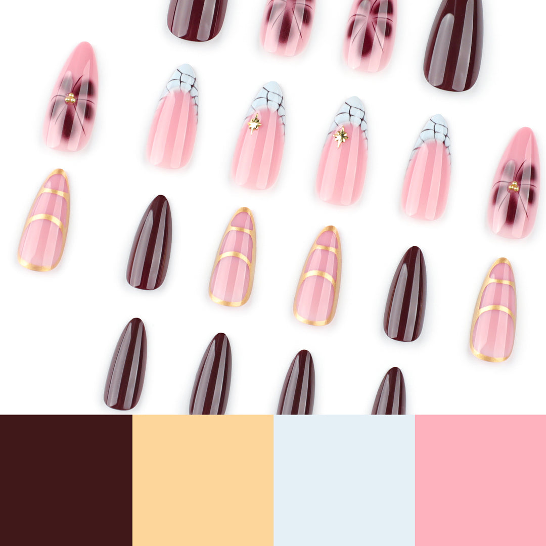 Artful Stiletto nails with gold accents and decorative floral designs Kalsten