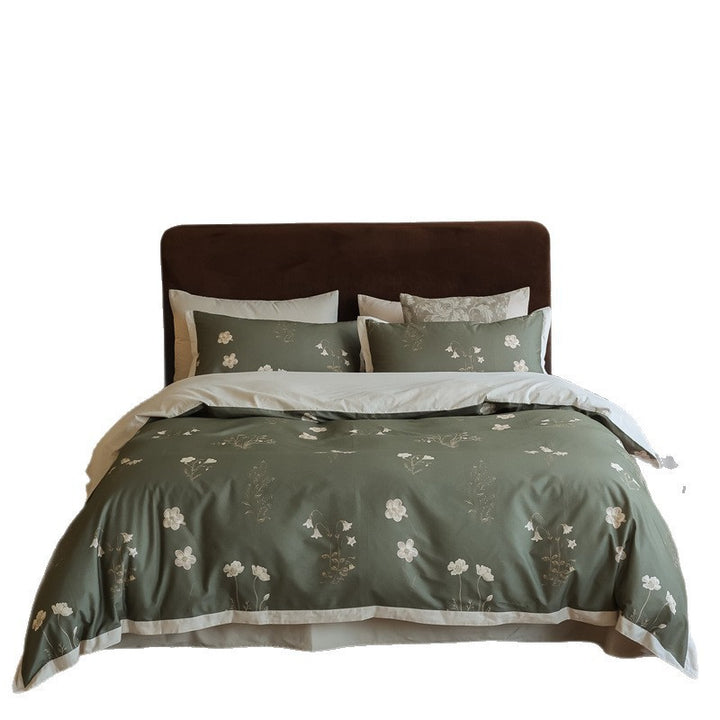 Cotton satin bedding set with subtle botanical print and contrasting hem edge