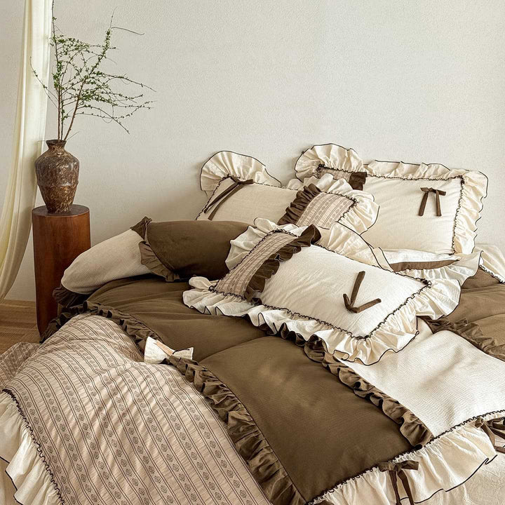 Country house style cotton-linen bedding set with ruffles, striped bedspread and decorative pillow