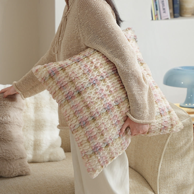 Square decorative cushion made of soft faux fur with inner cushion