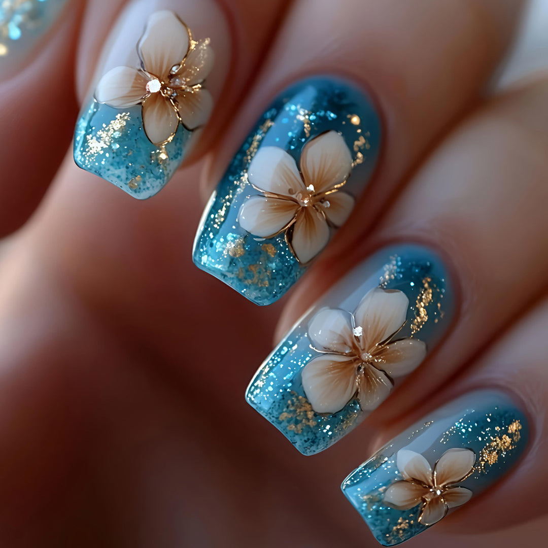 Artificial nails with floral accents and glitter patterns Kalsten