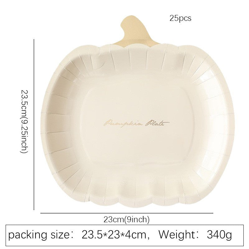 Disposable paper plates in pumpkin shape with spooky face design