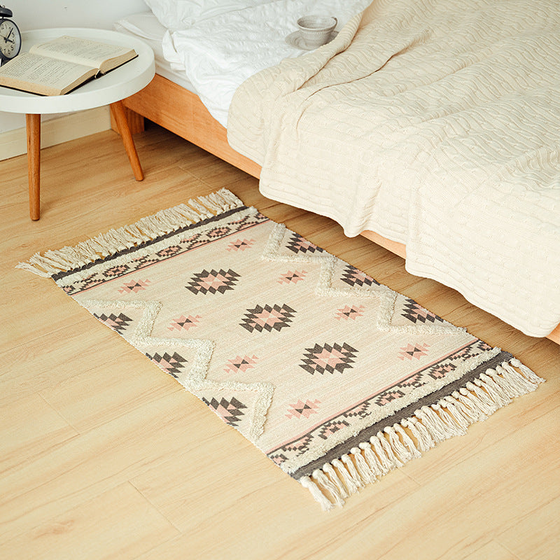Handwoven cotton runner with pompom tufting and decorative fringes