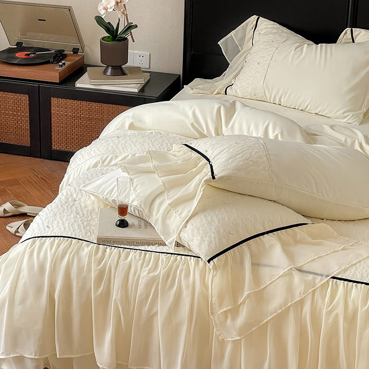 Luxurious bedding set with chiffon ruffles, comforter and contrast piping