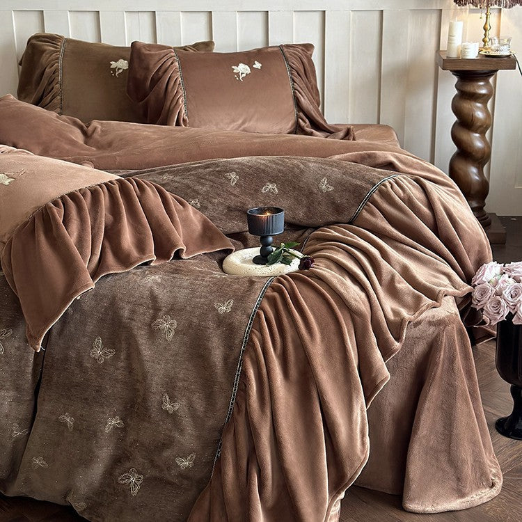 Satin bedding set with gathered ruffles and delicate butterfly embroidery