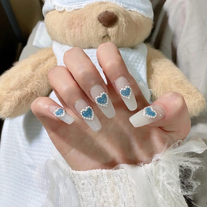 Artful nail art with heart-shaped accents Kalsten