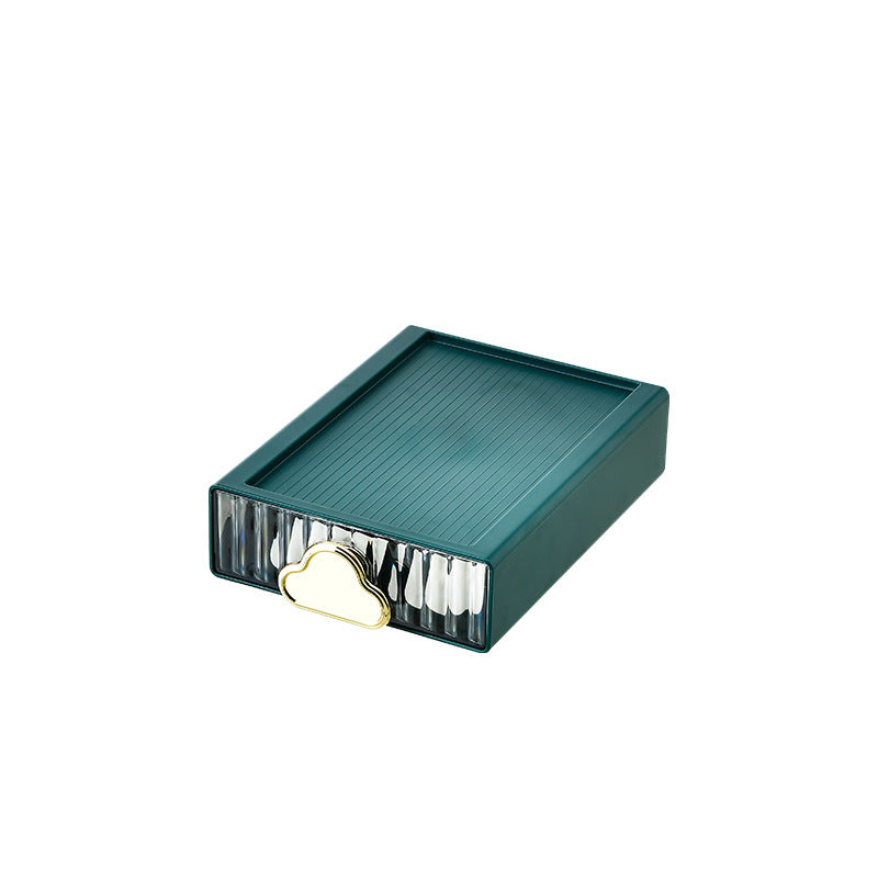 Small jewelry storage box with ribbed front and decorative cloud handle