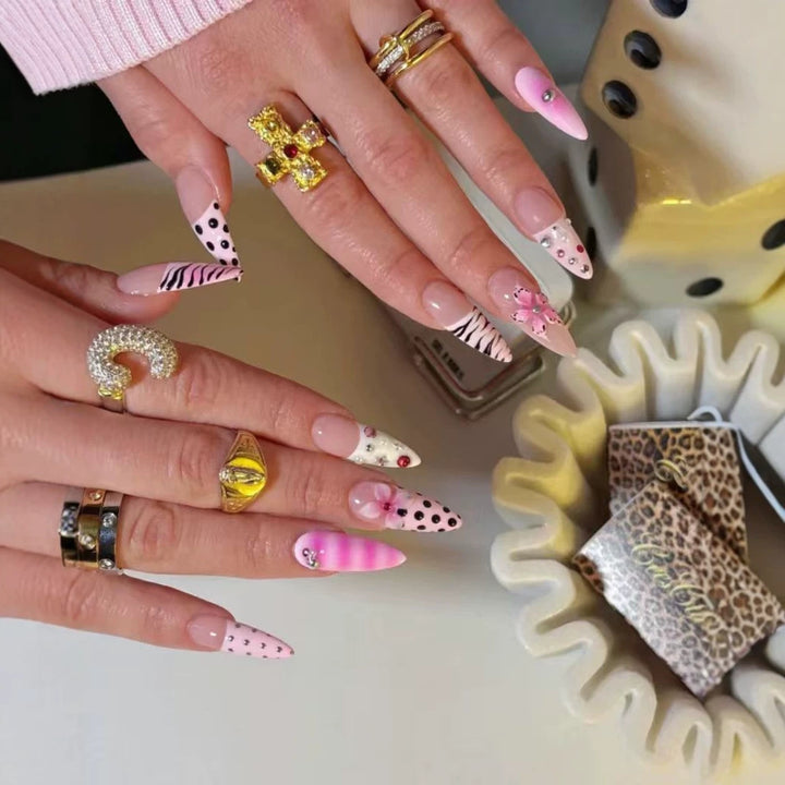 Artistic Press-On Nail Design with Unique Patterns and Rhinestone Accents Kalsten