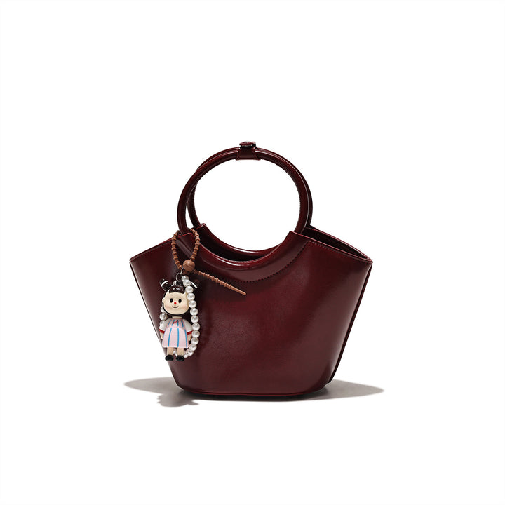 Chic Structured Handbag with Decorative Charm