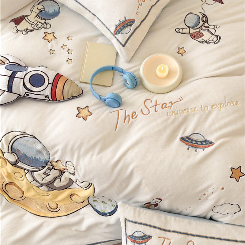 Child bedding set made of soft cotton blend with embroidered astronaut and rocket motif