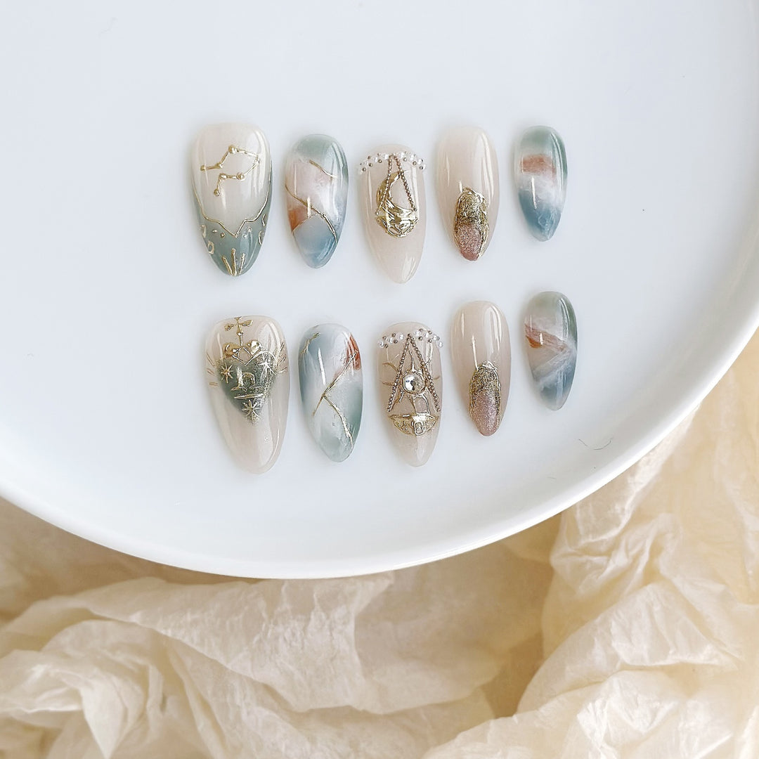 Artistic Press-On Nail Art Set with Celestial and Gem Accents