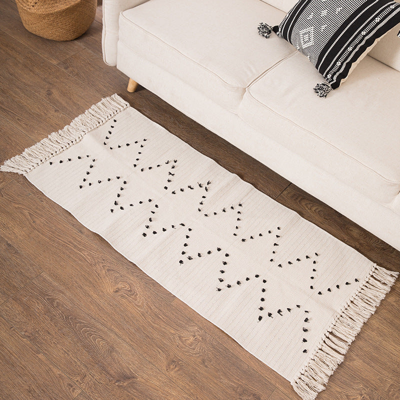 Woven runner rug with fringes and graphic polka dot pattern Kalsten