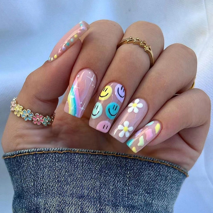 Artful Nail Art with Flower and Smiley Motifs Kalsten