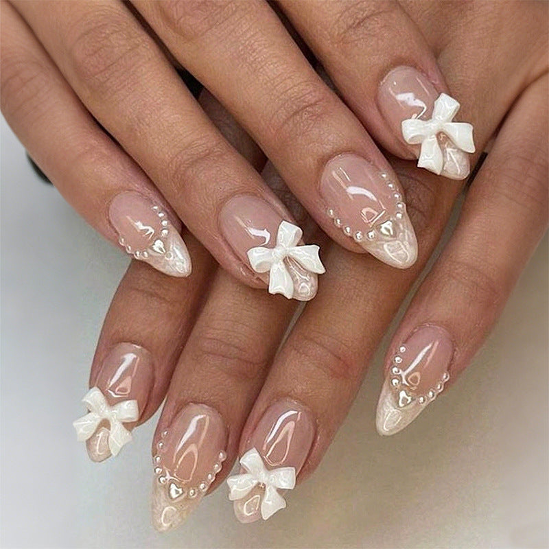 Artificial nail set with elegant bows and glitter details Kalsten