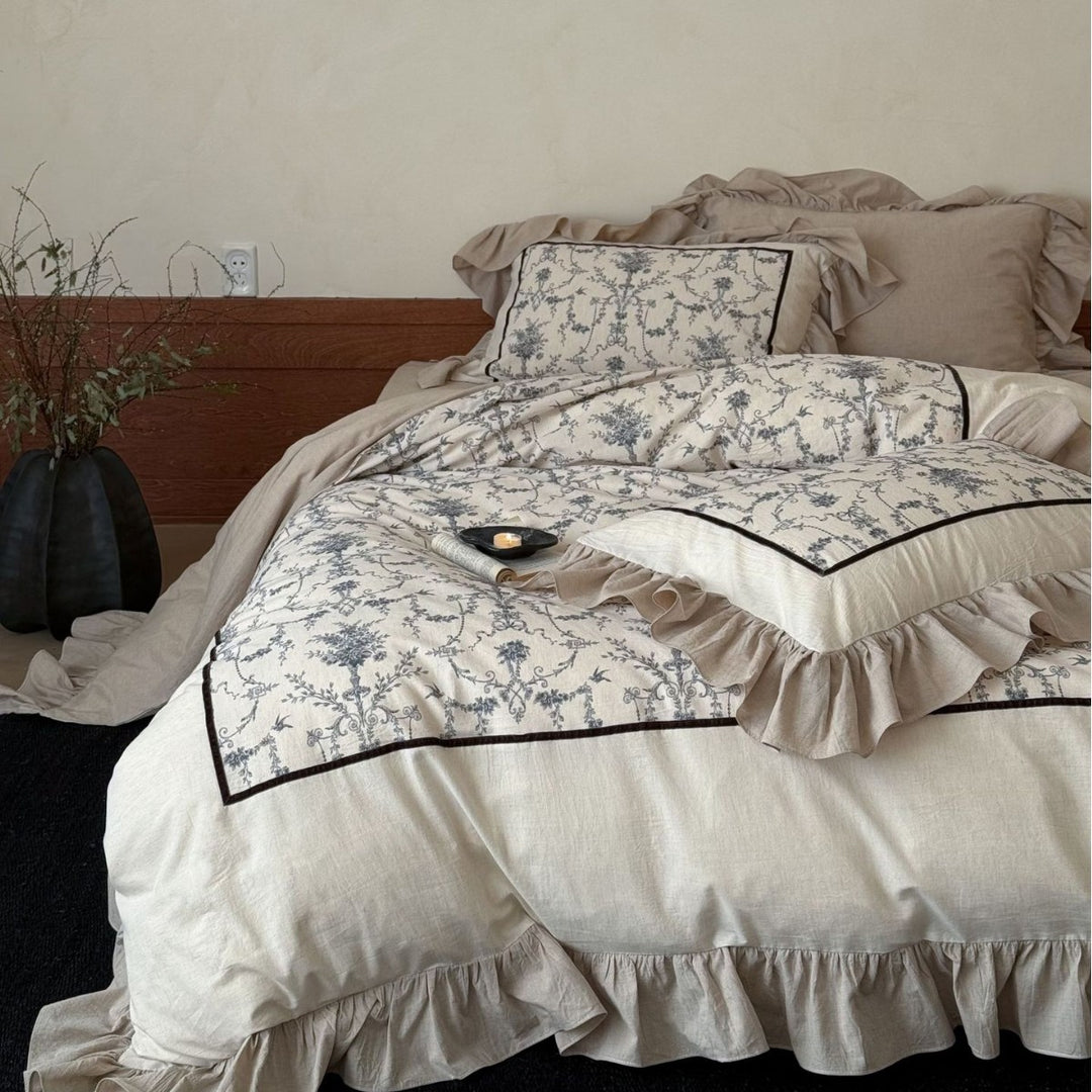 Romantic linen-look bedding set with ruffle, quilted center panel, and fine floral jacquard