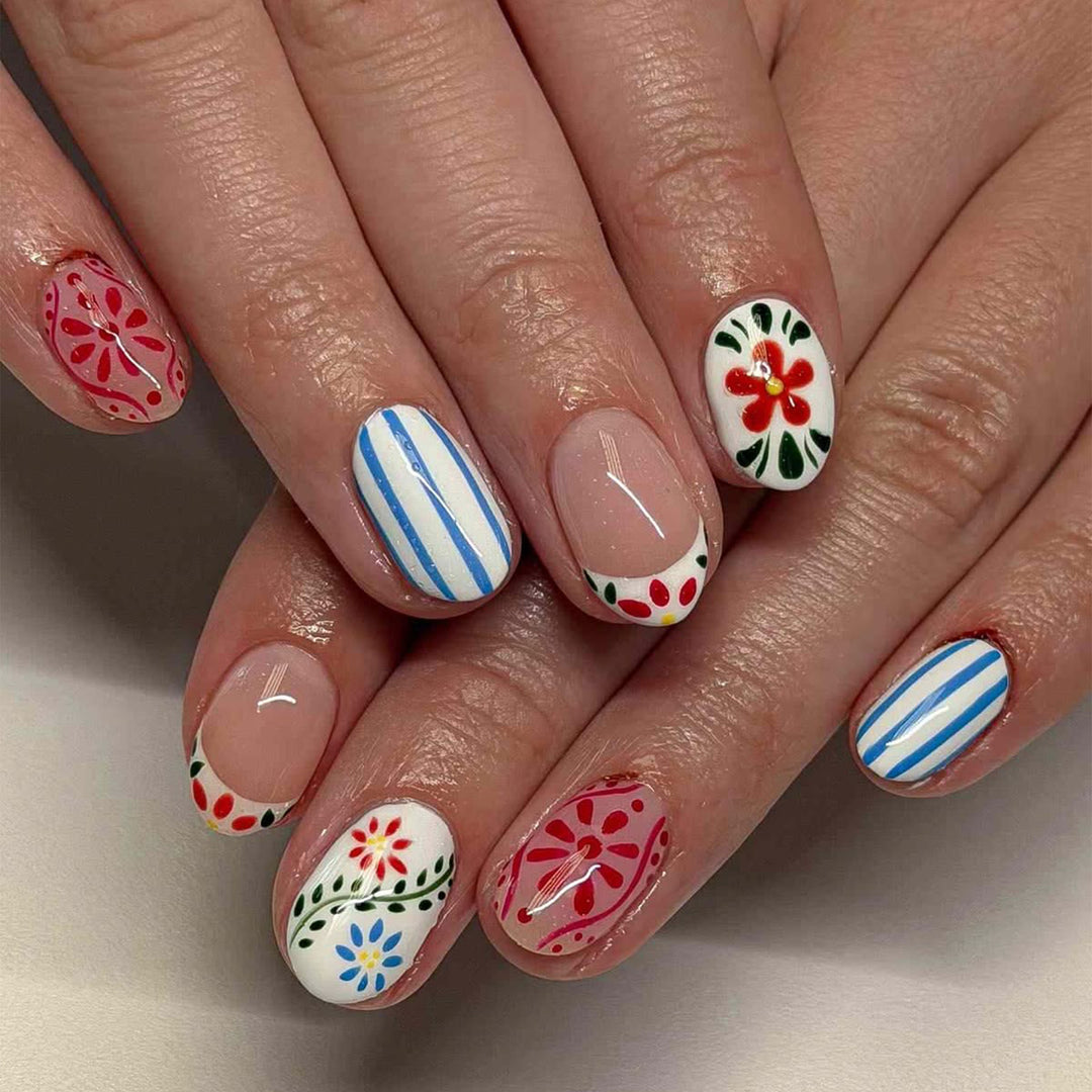 Artful nail art with floral design and colorful patterns Kalsten