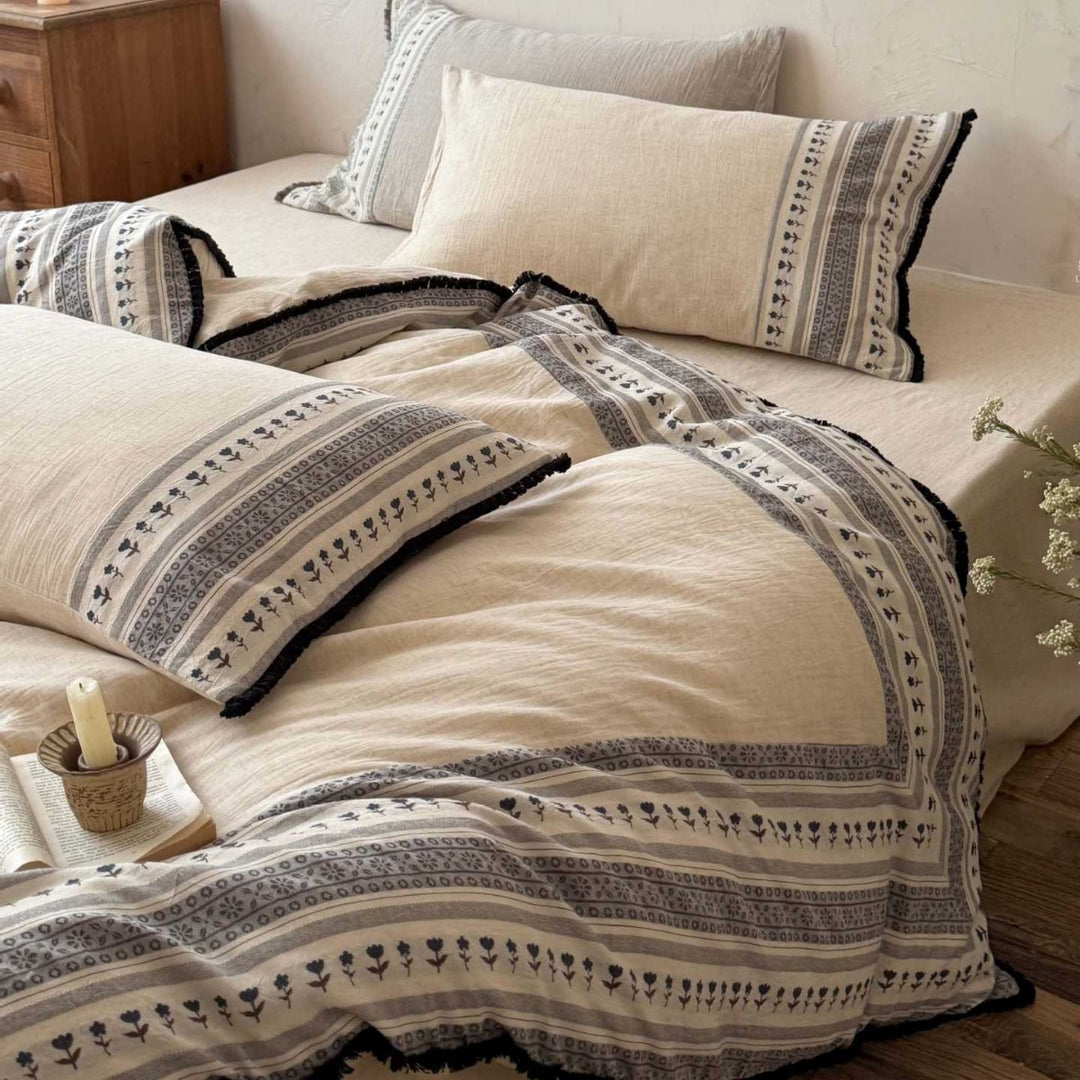 Country house style bedding set with striped floral border and fringes