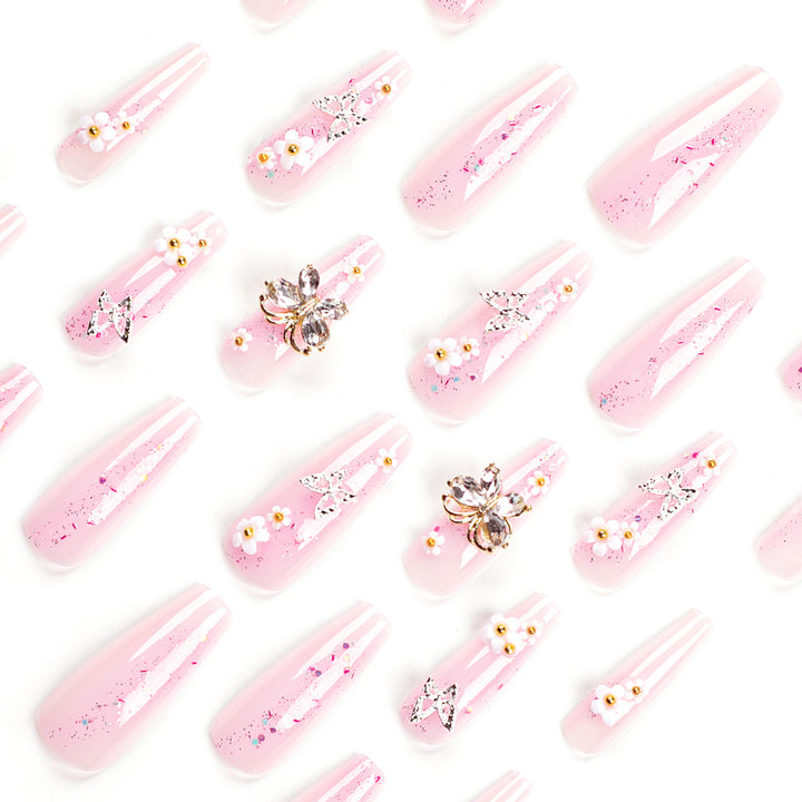 Artistic Nail Extensions with Glitter and Floral Accents Kalsten