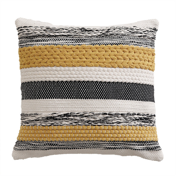 High-structured woven decorative cushion cover with fringes and bouclé application