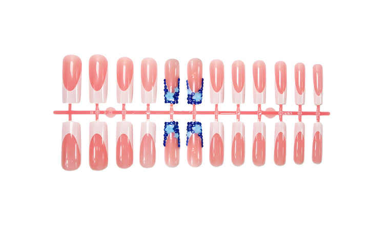 Artificial nail design with trendy blue accents and glitter coating Kalsten