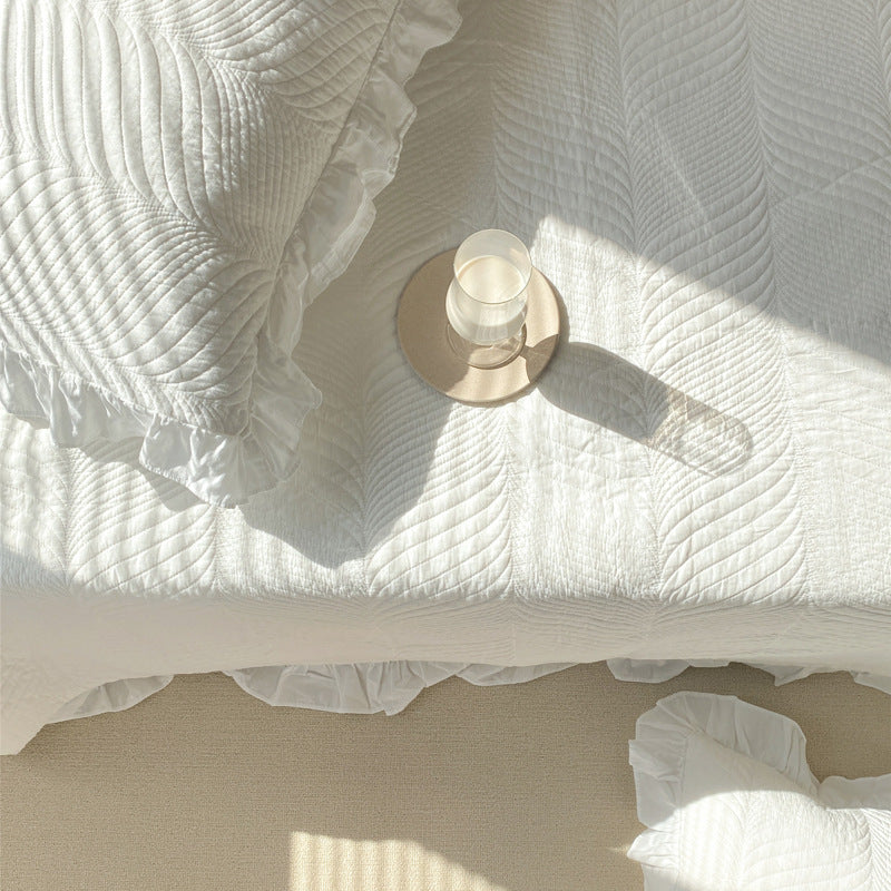 Quilted bedspread set with ruffle and embossed leaf quilting