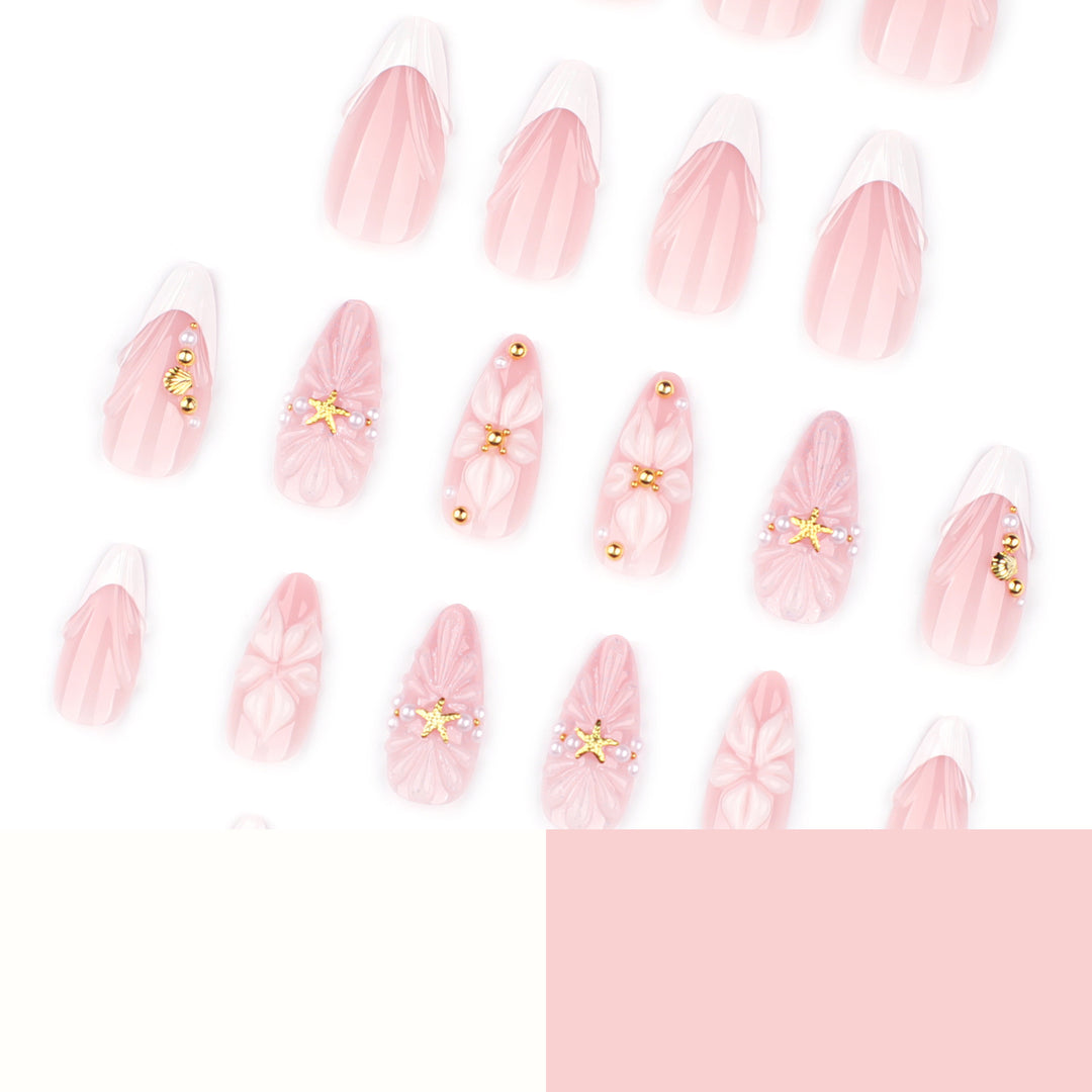 Artful nail art with shell and flower accents Kalsten