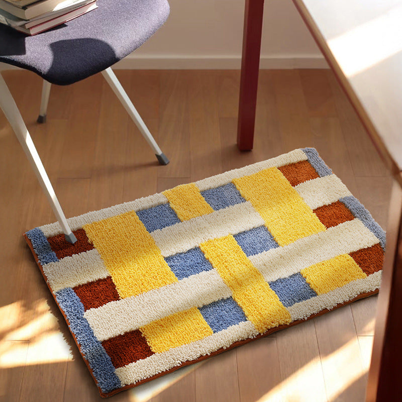 Rectangular tufted door mat with geometric block pattern and non-slip backing Kalsten