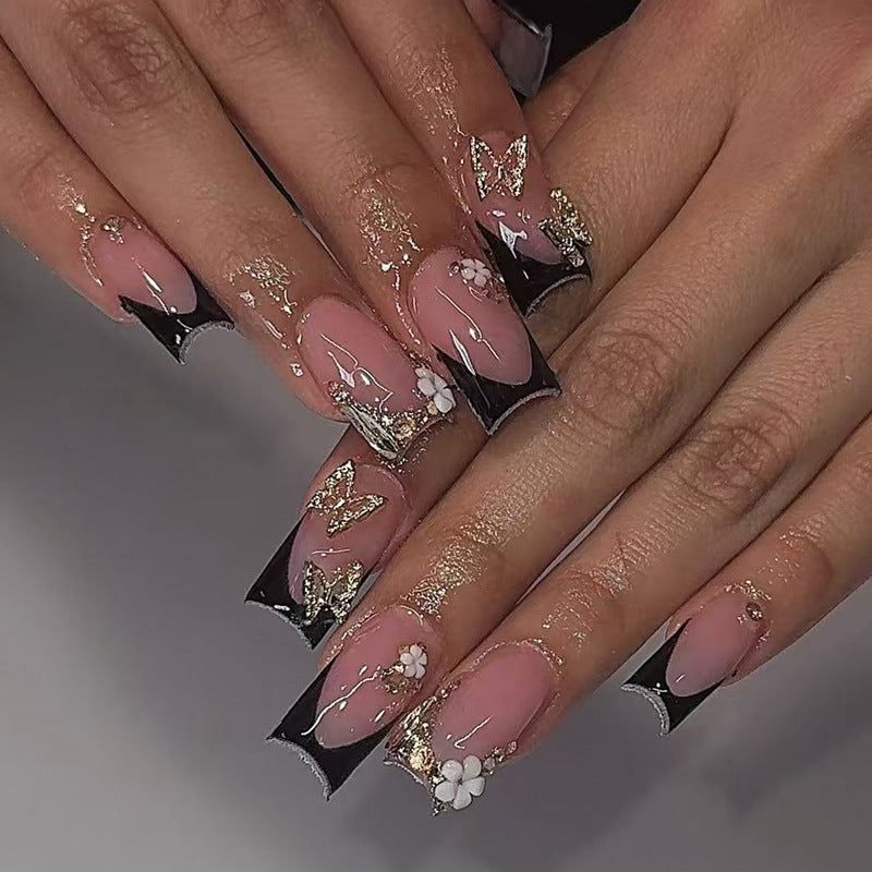 Creative nail art set with romantic floral designs and glamorous accents Kalsten