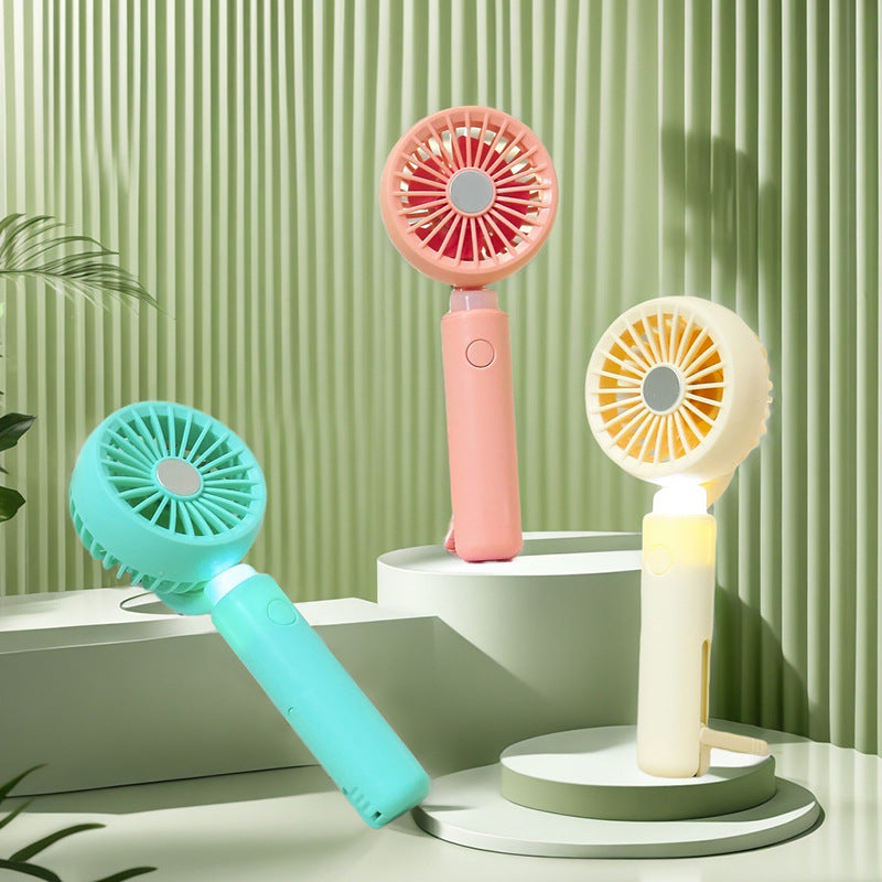 Women portable mini hand fan with integrated LED lighting and USB charging function Kalsten