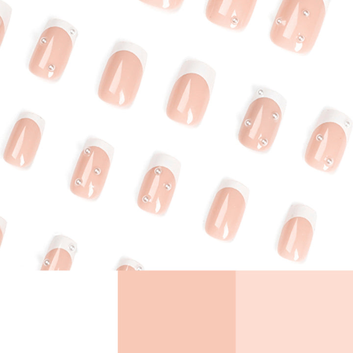 Artful nail art with elegant pearl and glitter accents Kalsten